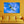 Modern living room with yellow sofa and wall art of a bird flying in blue sky