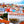 Colorful cityscape with red rooftops, vibrant buildings, and historic architecture