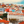 Colorful Lisbon cityscape with red rooftops, historic buildings, and a central monument