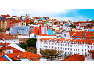 Colorful Lisbon cityscape with red rooftops, vibrant buildings, and historic architecture