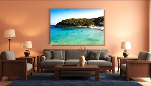 Modern living room with gray furniture featuring a large coastal beach art print on the wall
