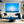 Modern living room with large sailboat wall art, blue and cream decor, indoor palm plant