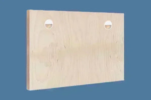 Light wood mounting board with two round keyhole slots against a blue background