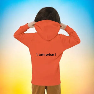 Child wearing orange eco-friendly hoodie with 'I am wise!' text on back, colorful background