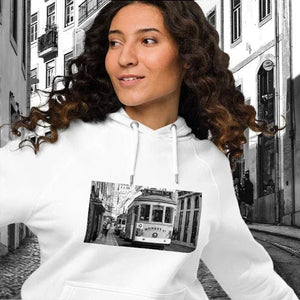 Woman wearing white eco-friendly unisex raglan hoodie with black and white streetcar photo print