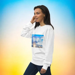 Woman wearing white unisex eco-friendly sweatshirt with sky and cloud photo print