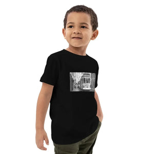 Child wearing black organic cotton t-shirt with vintage tram street photo print
