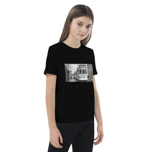 Girl wearing black organic cotton t-shirt with vintage tram street photo print