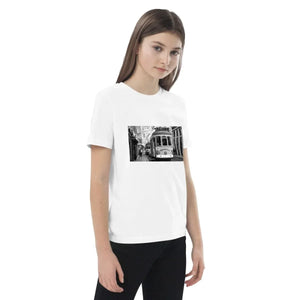Girl wearing white organic cotton t-shirt with black and white tram photo print