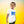 Child wearing white organic cotton T-shirt with flying bird print, yellow gradient background
