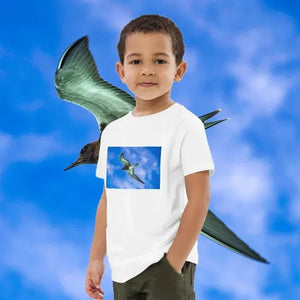 Child wearing organic cotton t-shirt with bird print, standing in front of blue sky and bird