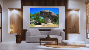 Modern living room with framed landscape photo of mushroom-shaped rock formation on wall
