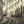 Sepia-toned photo of a curved tramway street in a European city with old buildings and pedestrians.