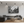 Modern living room with black and white urban street photography canvas and sectional sofa