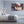 Modern bedroom with large wall art showing close-up photo of hermit crabs on rocky sand