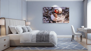 Modern bedroom with large wall art showing close-up photo of hermit crabs on rocky sand
